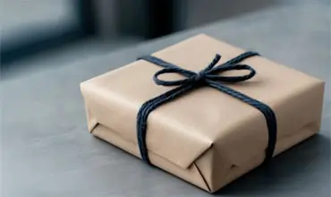 Custom wrapped package on a table.