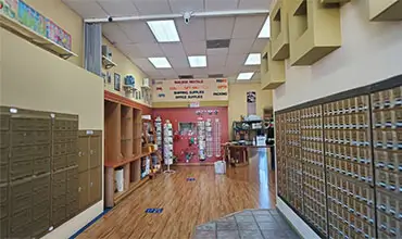 Mail Boxes and More inside of store and view of its products and services offered.