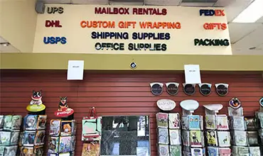 Mail Boxes and More inside of store and view of its products and services offered.