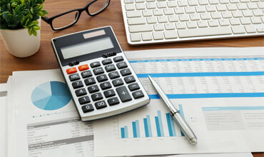 Financial accounting with calculator and financial data.