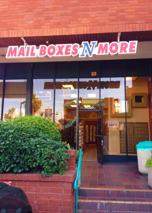 Mail Boxes N More store front. It has a brick facade.